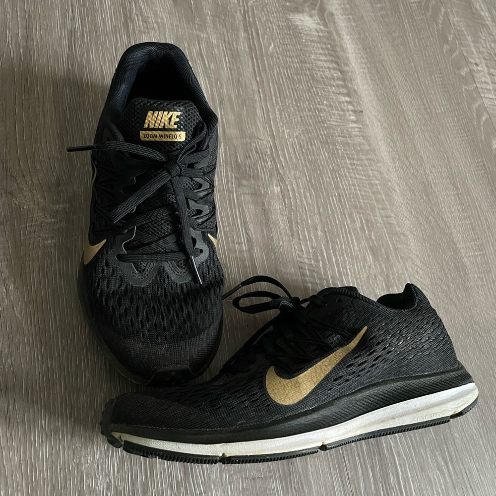 Nike shoes black gold and white